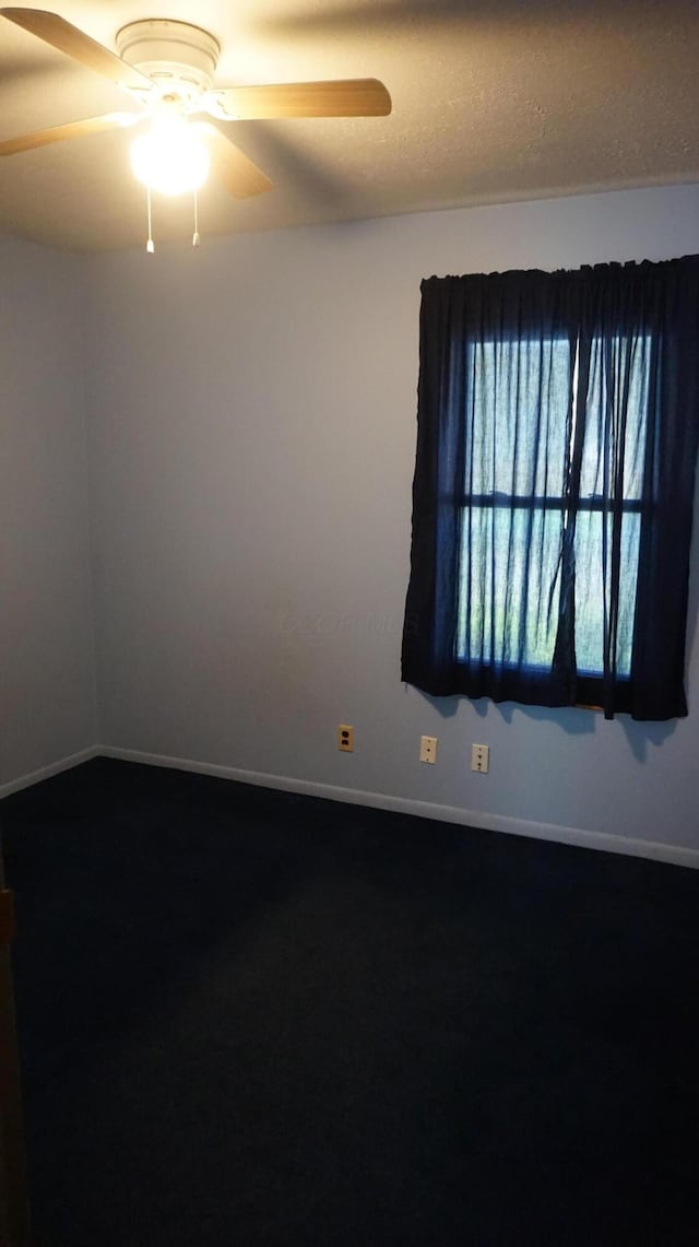 unfurnished room featuring a textured ceiling and ceiling fan