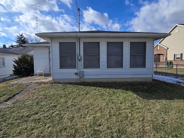 back of house featuring a yard and a patio