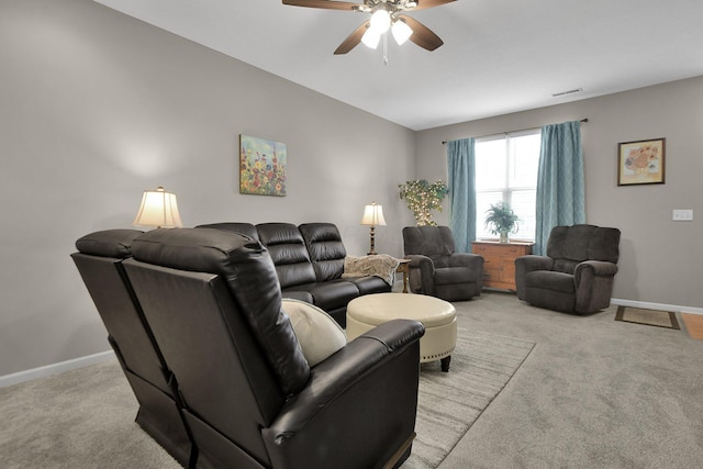 carpeted living room with ceiling fan