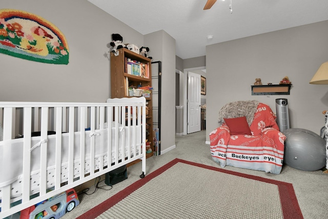 bedroom with light carpet and ceiling fan