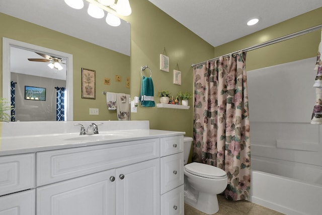 full bathroom featuring shower / tub combo with curtain, tile patterned flooring, vanity, ceiling fan, and toilet