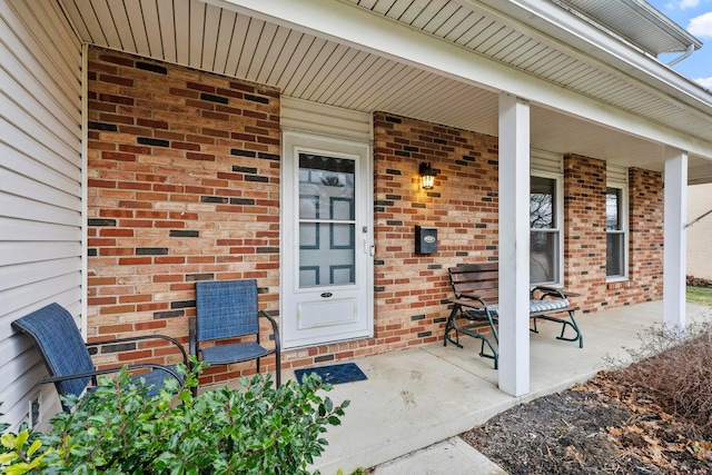 entrance to property featuring covered porch