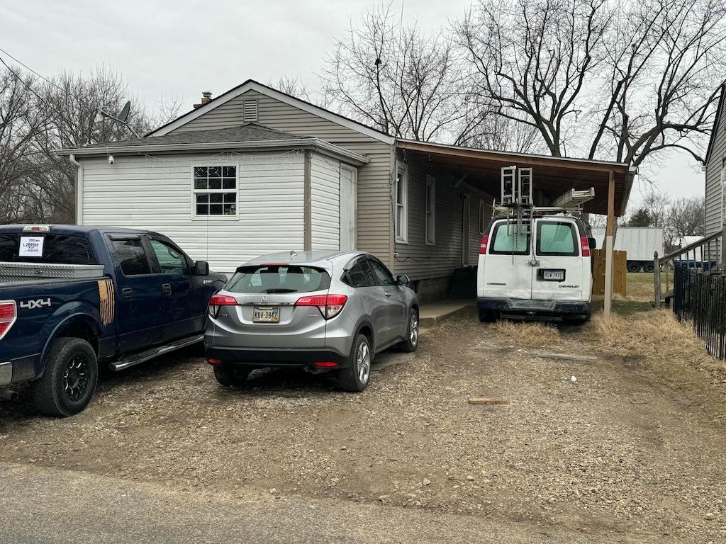 view of front of property with a carport