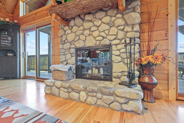 living room with hardwood / wood-style flooring and a fireplace