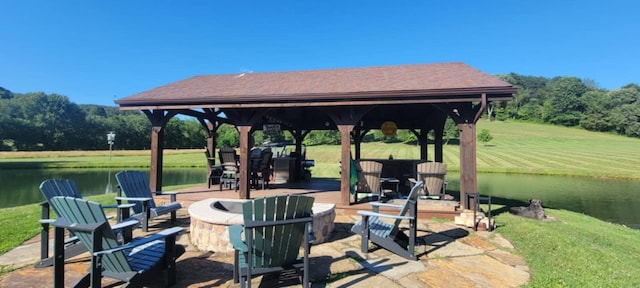 view of patio / terrace featuring a gazebo and a water view