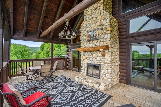 20358 Buena Vista Rd, Rockbridge, OH 43149 - wooden terrace featuring an outdoor stone fireplace and outdoor dining area