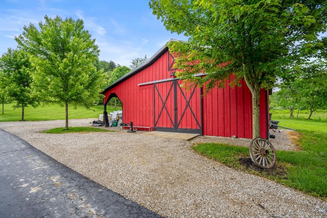 20358 Buena Vista Rd, Rockbridge, OH 43149 - view of barn with a lawn
