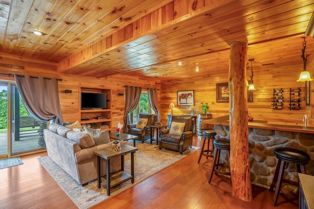 20358 Buena Vista Rd, Rockbridge, OH 43149 - living room with wooden ceiling, hardwood / wood-style flooring, wood walls, and bar with sink