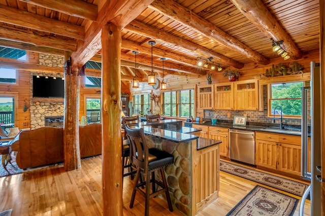 20358 Buena Vista Rd, Rockbridge, OH 43149 - kitchen featuring dishwasher, a sink, wooden ceiling with exposed beams, wood walls, and light wood finished floors