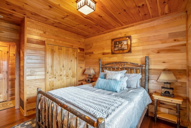 20358 Buena Vista Rd, Rockbridge, OH 43149 - bedroom featuring wooden walls, wooden ceiling, wood finished floors, and a closet