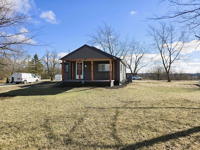 bungalow with a front lawn and a porch