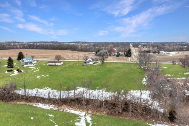 birds eye view of property with a water view and a rural view