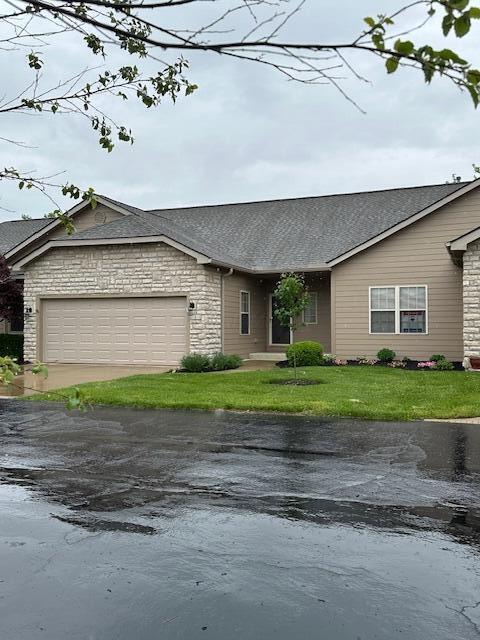 3 Claire Ct, Circleville, OH 43113 - ranch-style house with an attached garage, stone siding, a front yard, driveway, and a shingled roof