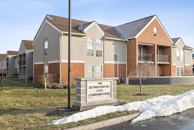 view of building exterior with central AC unit