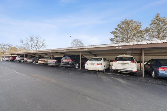 view of parking / parking lot with a carport