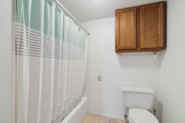 bathroom with toilet, shower / bathtub combination with curtain, and a textured ceiling