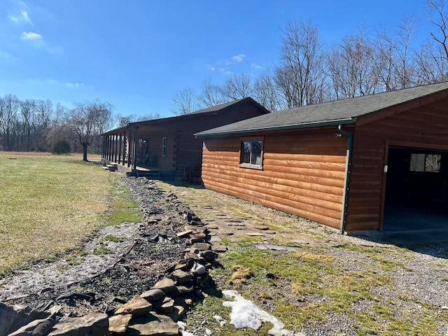 view of home's exterior with a yard and a garage