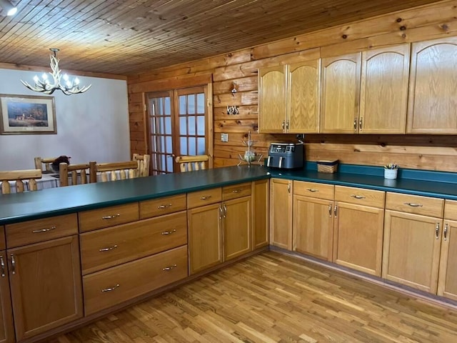 kitchen featuring light hardwood / wood-style flooring, hanging light fixtures, wooden ceiling, french doors, and a chandelier