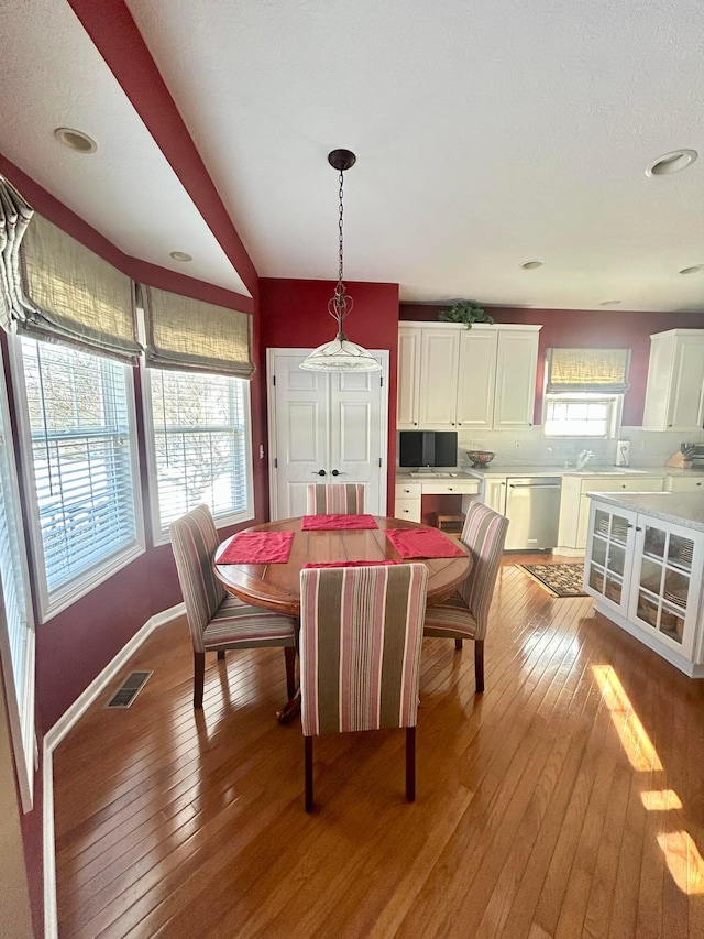 dining space featuring light hardwood / wood-style floors