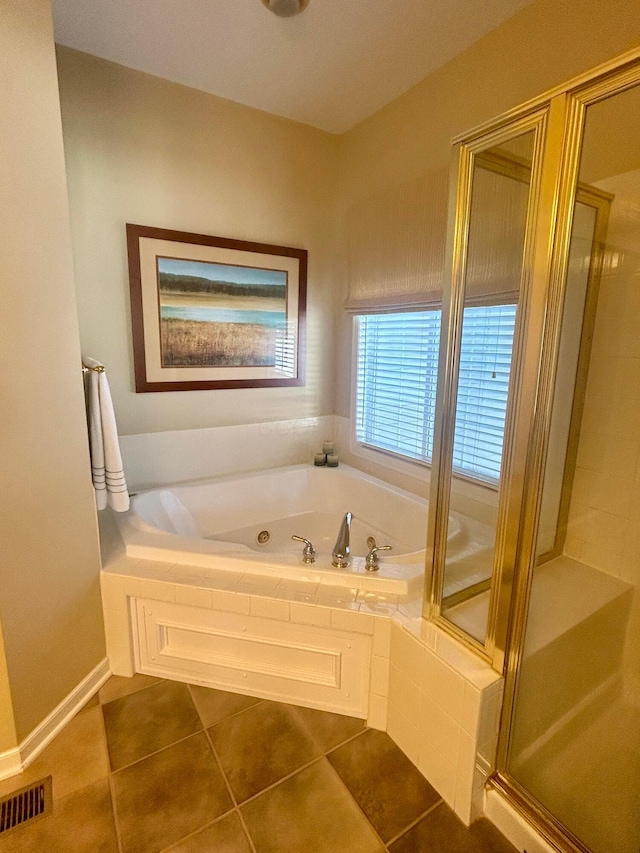 bathroom with tile patterned flooring and plus walk in shower