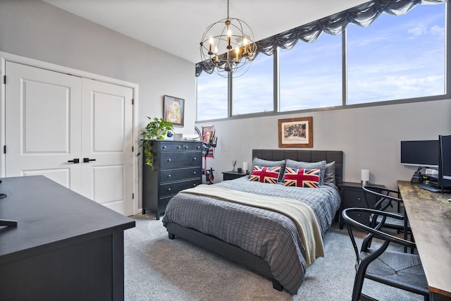 bedroom with light carpet, a notable chandelier, and a closet