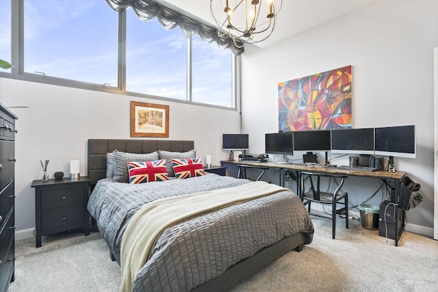 bedroom featuring an inviting chandelier and carpet