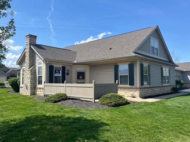 1240 Paddock Loop, Washington Court House, OH 43160 - view of property exterior featuring roof with shingles, stone siding, a yard, and a chimney