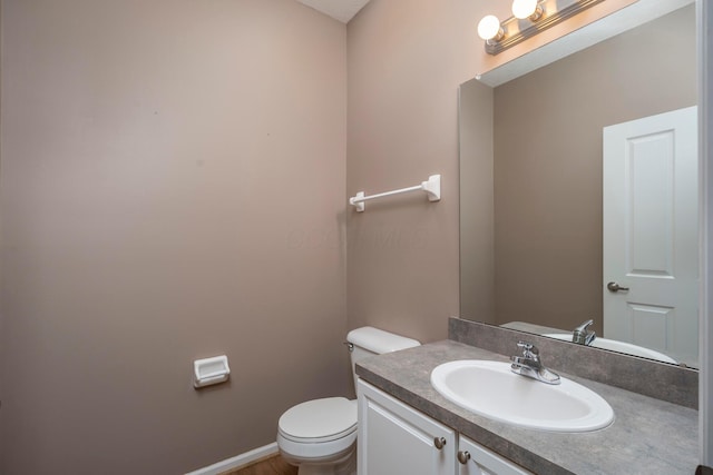 1240 Paddock Loop, Washington Court House, OH 43160 - half bath featuring toilet, vanity, and baseboards