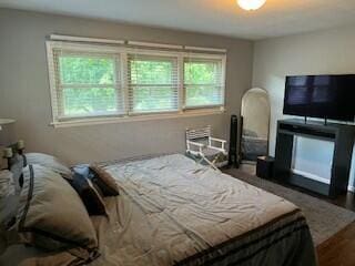 bedroom with dark wood-type flooring