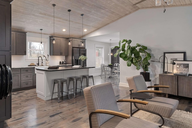 220 Nez Perce Ln, Sugar Grove, OH 43155 - dining space featuring wood ceiling, healthy amount of natural light, lofted ceiling, wood finished floors, and recessed lighting