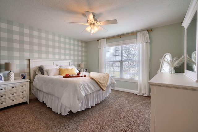 carpeted bedroom with ceiling fan and a textured ceiling