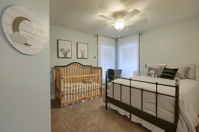 bedroom featuring ceiling fan, carpet flooring, and a textured ceiling