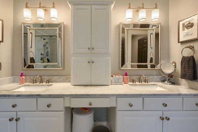 bathroom featuring vanity and an enclosed shower