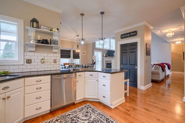 kitchen with white cabinetry, a healthy amount of sunlight, dishwasher, and light hardwood / wood-style floors