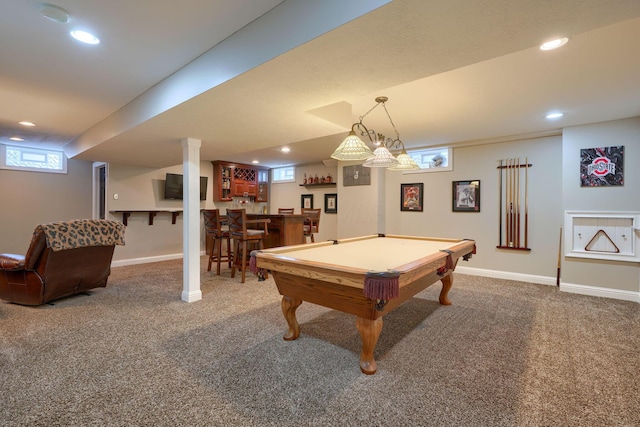 game room with bar and carpet