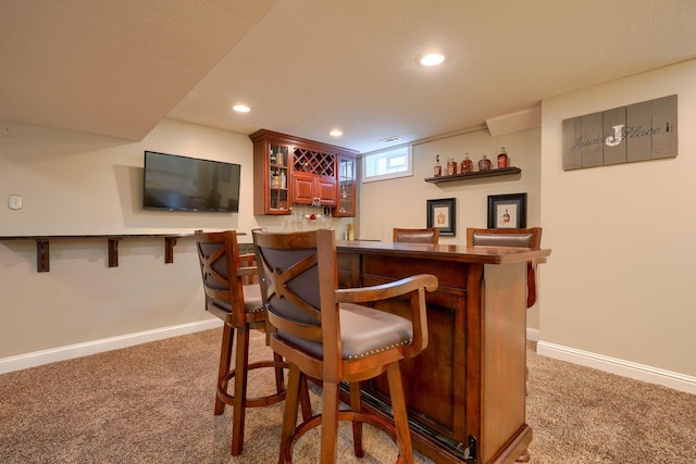 bar featuring dark colored carpet