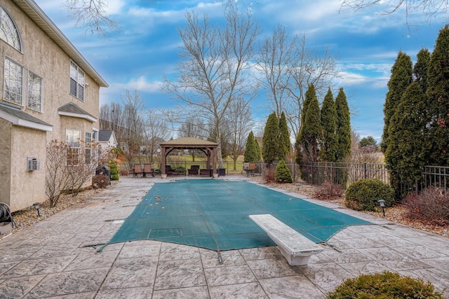 view of swimming pool with a gazebo and a patio area