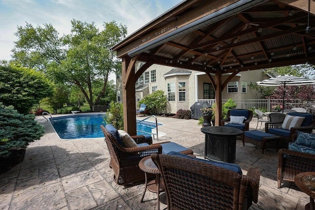 view of pool with a gazebo, area for grilling, an outdoor hangout area, and a patio area