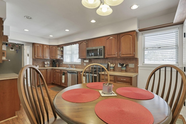 dining room featuring sink and hardwood / wood-style floors