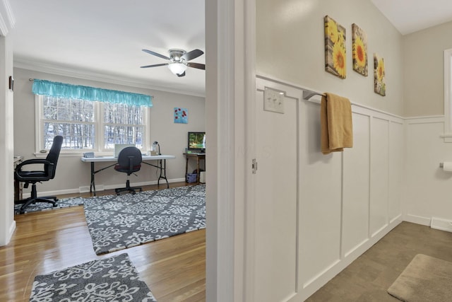 office featuring ceiling fan, ornamental molding, and light hardwood / wood-style floors