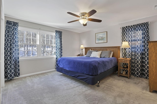 bedroom with light carpet and ceiling fan