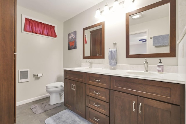 bathroom with vanity, toilet, and tile patterned flooring