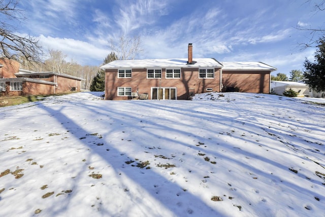 view of snow covered property