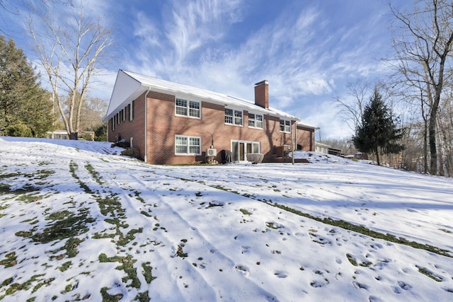 view of snow covered house