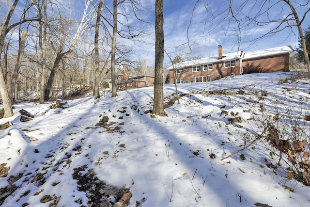 view of yard layered in snow