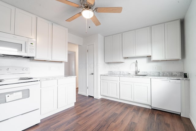 kitchen featuring white cabinetry and white appliances