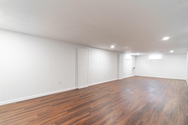 basement featuring dark wood-type flooring