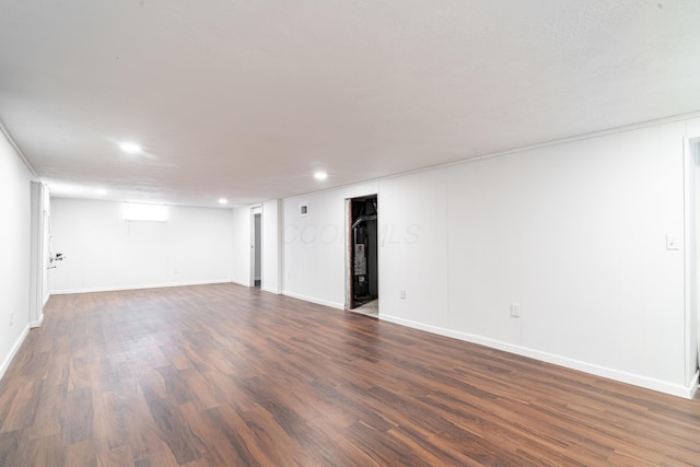 unfurnished room featuring dark wood-type flooring