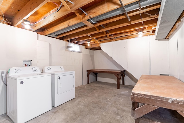 clothes washing area featuring separate washer and dryer