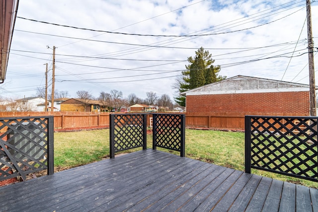 wooden terrace with a lawn